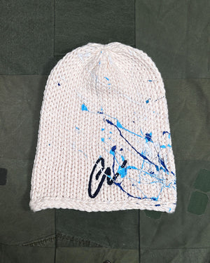 Open image in slideshow, IVORY PAINT SPLATTERED &quot;GL&quot; BEANIE
